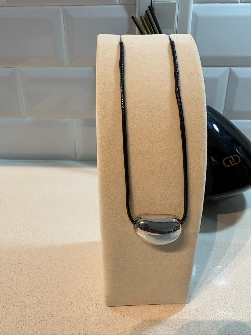 Silver Bean Pendant Necklace on Black Cord